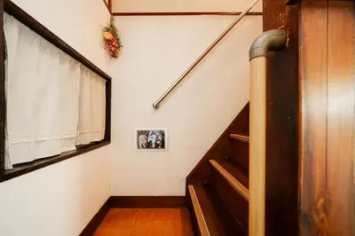a staircase in a house with a window and a stair case at Japanese Traditional Villa 8ppl 5min to ST in Tokyo