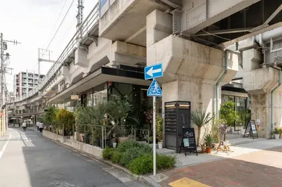 a blue street sign in front of a building at Maison Miyashita in Tokyo