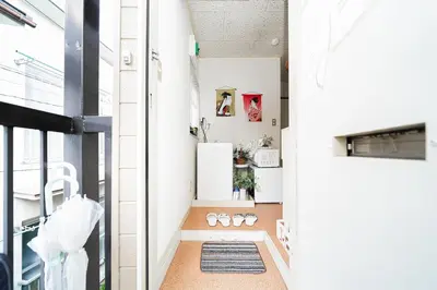 a room with a hallway with a rug on the floor at 2 min walk to Komagome ST 4ppl superior apart in Tokyo