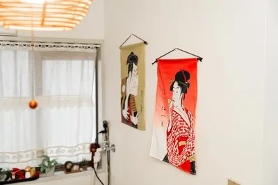 two pictures hanging on a wall in a room at 2 min walk to Komagome ST 4ppl superior apart in Tokyo