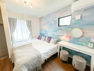 a bedroom with a bed and a desk in it at Hotel Ikebukuro Fine Coat in Tokyo