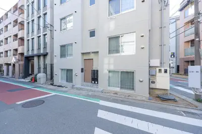 an empty street in a city with buildings at \u30ea\u30a2\u30e9\u30a4\u30ba\u897f\u5c0f\u5c71 in Tokyo