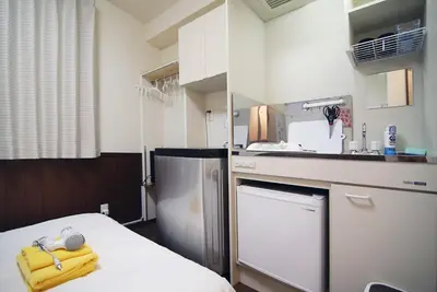 a kitchen with a sink and a dishwasher at Central Shinjuku, Near Train Station, Quiet Area, No Stairs, Room 102 in Tokyo