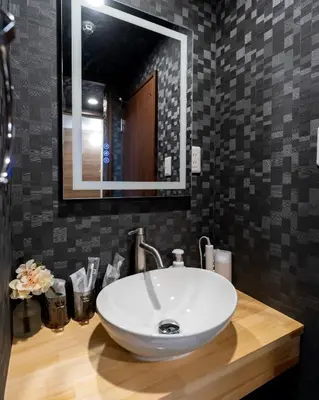 a bathroom with a white sink and a mirror at ohayo\u4e21\u56fd in Tokyo