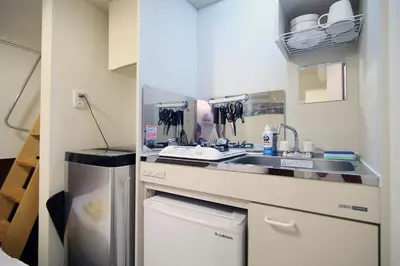 a small kitchen with a sink and a counter at Quiet Area, Close to Station, Central Shinjuku, Room 202 in Tokyo