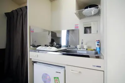 a small kitchen with a sink and a dishwasher at Central Shinjuku, Quiet Area, Close to Station, No Stairs, Room101 in Tokyo