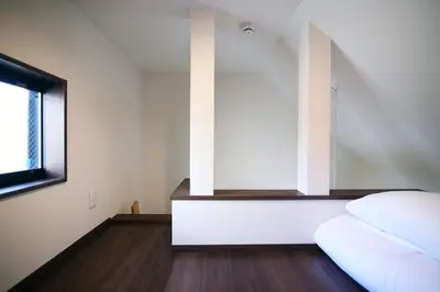 a bedroom with a bed and a window at Close to Station, Quiet Area, Central Shinjuku, Room 203 in Tokyo