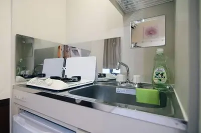 a kitchen with a sink and a counter top at Close to Station, Quiet Area, Central Shinjuku, Room 203 in Tokyo