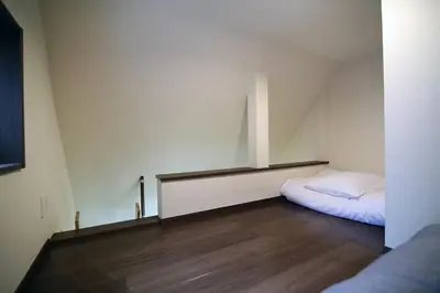 a small room with a bed in the corner of a room at Central Shinjuku, Quiet Area, Close to Station, Room205 in Tokyo