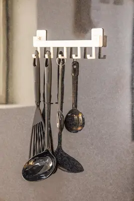 two forks and spoons are hanging from a rack at R201-Shinjuku 13 min Up to 8 people 60 sqm Full renovation Roppongi and Tsukiji direct access Family group 7 min to Ochiai Minami Nagasaki Station in Tokyo