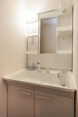 a bathroom with a white sink and a mirror at R301-Shinjuku 13 min Maximum 8 people 60 sqm Roppongi, Tsukiji direct access Full renovation 7 min walk from Ochiai Minami-Nagasaki Station in Tokyo