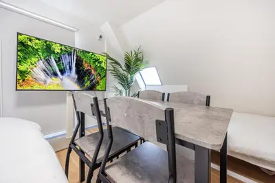a dining room with a table and chairs at R401-Shinjuku 13 minutes Maximum 4 people 30 square meters Full renovation Roppongi and Tsukiji direct access Family group best 7 minutes from Ochiai Minami-Nagasaki Station in Tokyo