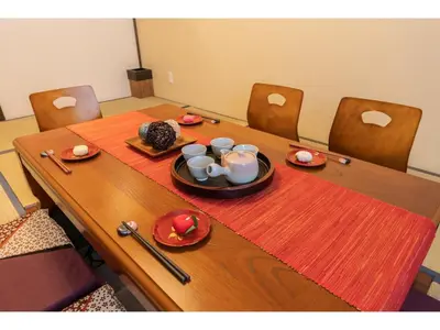 a table with plates and cups on top of it at YADOYA Ryusenjicho - Vacation STAY 86915v in Tokyo
