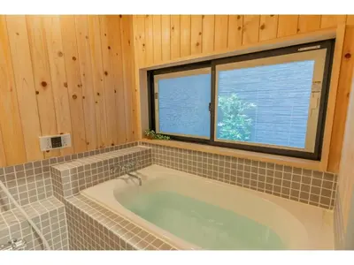 a bath tub in a bathroom with a window at YADOYA Ryusenjicho - Vacation STAY 86915v in Tokyo