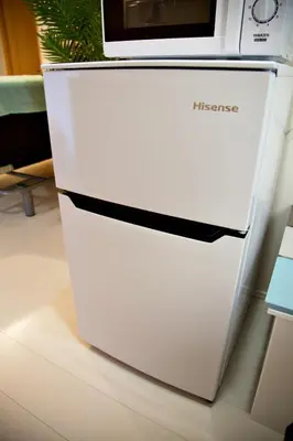 a white refrigerator with a microwave on top of it at Regalia Hills Shibuya Dogenzaka - Vacation STAY 18960 in Tokyo