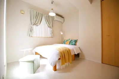 a small bedroom with a bed and a window at Regalia Hills Shibuya Dogenzaka - Vacation STAY 18960 in Tokyo