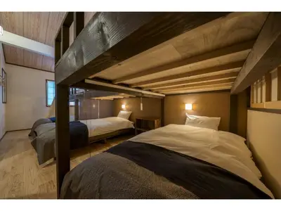 two beds in a room with two loft beds at YADOYA Matsugaya - Vacation STAY 91980v in Tokyo