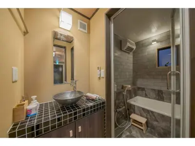 a bathroom with a sink and a bath tub at YADOYA Matsugaya - Vacation STAY 91980v in Tokyo