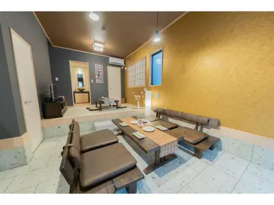 a living room with a table and a couch at YADOYA Negishi - Vacation STAY 92008v in Tokyo