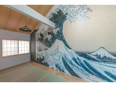 a mural of a wave on a wall in a room at YADOYA Negishi - Vacation STAY 92008v in Tokyo