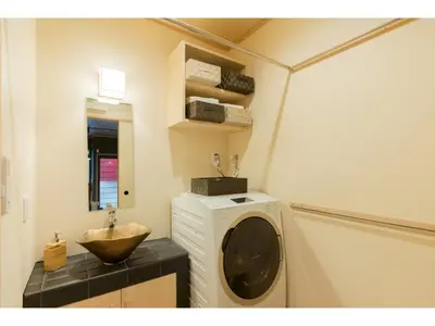 a bathroom with a washing machine and a sink at YADOYA Negishi - Vacation STAY 92008v in Tokyo