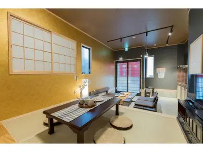 a living room with a table and a couch at YADOYA Negishi - Vacation STAY 92008v in Tokyo
