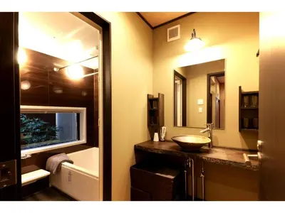 a bathroom with a sink and a large mirror at YADOYA Asakusa-Honkan - Vacation STAY 92044v in Tokyo