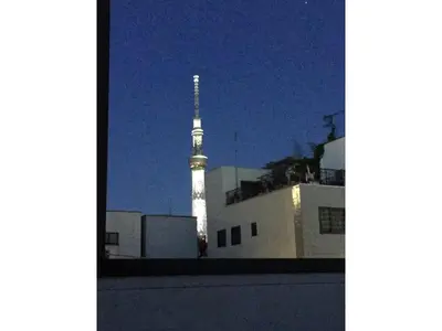 a tv tower is lit up in the sky at night at YADOYA Asakusa-Honkan - Vacation STAY 92044v in Tokyo