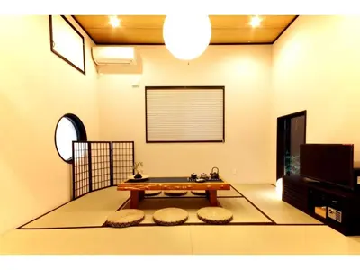 a living room with a table and a tv at YADOYA Asakusa-Honkan - Vacation STAY 92044v in Tokyo