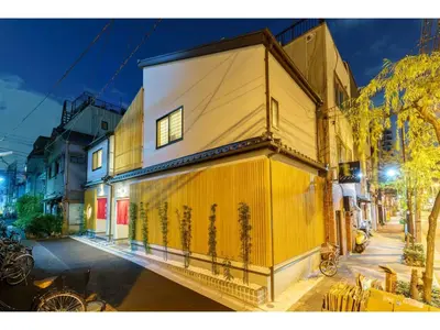 a building on the side of a street at night at YADOYA Yanagitori West - Vacation STAY 92053v in Tokyo