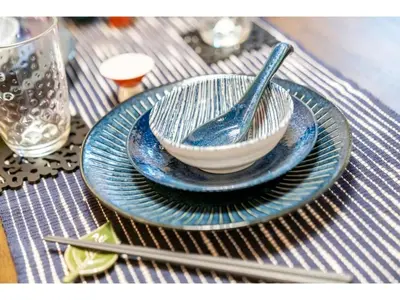 a blue and white bowl and plates on a table at YADOYA Yanagitori East - Vacation STAY 92067v in Tokyo