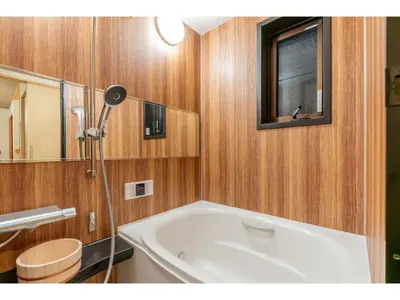 a bathroom with a bath tub and a mirror at YADOYA Yanagitori East - Vacation STAY 92067v in Tokyo