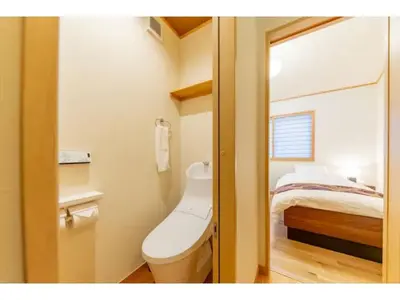 a bathroom with a toilet and a bed at YADOYA Yanagitori East - Vacation STAY 92067v in Tokyo