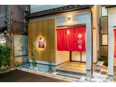 a door with a red curtain on a building at YADOYA Yanagitori East - Vacation STAY 92067v in Tokyo