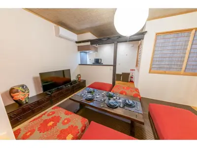 a living room with a couch and a table at YADOYA Yanagitori East - Vacation STAY 92067v in Tokyo