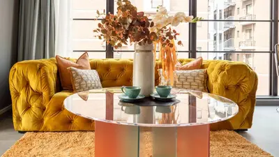 a living room with a yellow couch and a glass table at LANG HOTEL Asakusa#Senso-ji Temple#1Floor 1Room 85m2# Max 8ppl in Tokyo