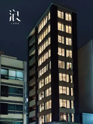 a tall building with illuminated windows at night at LANG HOTEL Asakusa#Senso-ji Temple#1Floor 1Room 85m2# Max 8ppl in Tokyo