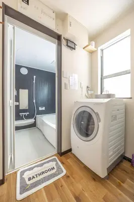 a laundry room with a washer and dryer at Nogata Station 3 minutes on foot , 15 minutes to Shinjuku in Tokyo