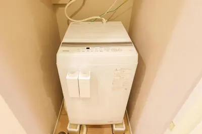 a washing machine in the corner of a room at \u5922\u306e\u5bbf \u7a42\u7a7a 123t in Tokyo