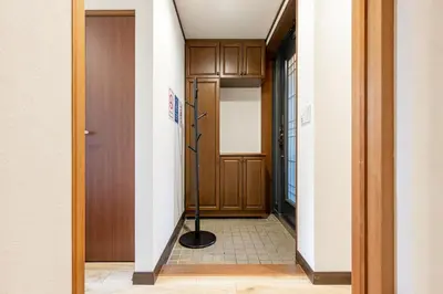 a hallway with a door with a pole in it at Shibuya-honmachi 2-3f in Tokyo