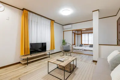 a living room with a television and a couch at Shibuya-honmachi 2-3f in Tokyo