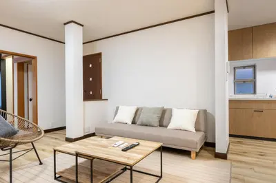 a living room with a couch and a table at Shibuya-honmachi 2-3f in Tokyo