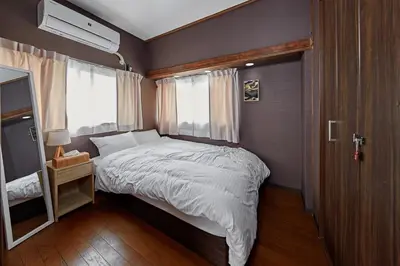a small bedroom with a bed and a window at Y's INN Oyama 021T in Tokyo