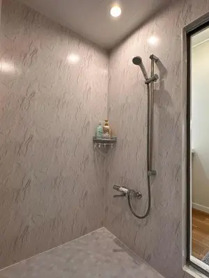 a shower in a bathroom with a wall at \u516b\u5e83101Nearby Tokyo Skytree in Tokyo