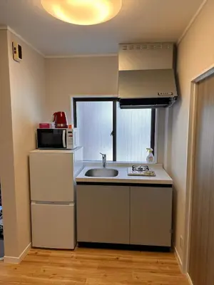 a small kitchen with a sink and a microwave at \u516b\u5e83201Nearby Tokyo Skytree in Tokyo