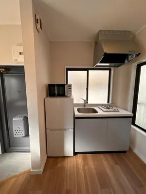 a small kitchen with a sink and a refrigerator at 八広301 Nearby Tokyo Skytree & Asakusa in Tokyo