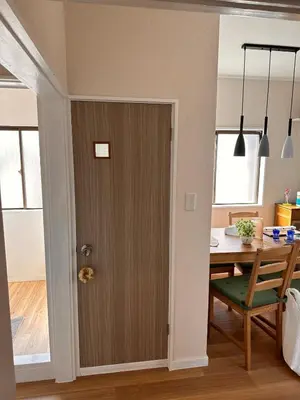 a door leading into a dining room with a table at 八広301 Nearby Tokyo Skytree & Asakusa in Tokyo
