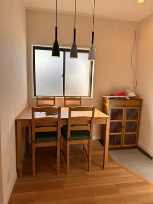 a dining room table with two chairs and a window at 八広301 Nearby Tokyo Skytree & Asakusa in Tokyo
