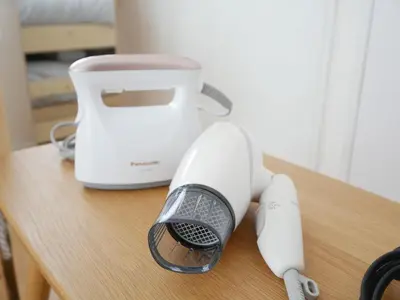 a white blender and a hair dryer on a table at CasaN 402 in Tokyo