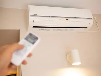 a person holding a wii remote in a room at Super Hotel Tokyo JR Kamata Nishiguchi in Tokyo